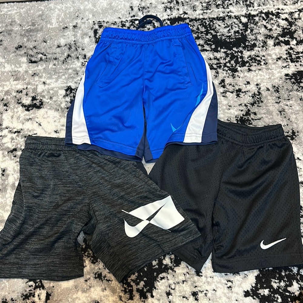 Three pairs size 6 Nike shorts for boys.